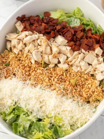 A romaine based salad topped with bacon, chicken, toasted breadcrumbs, and parmesan cheese.