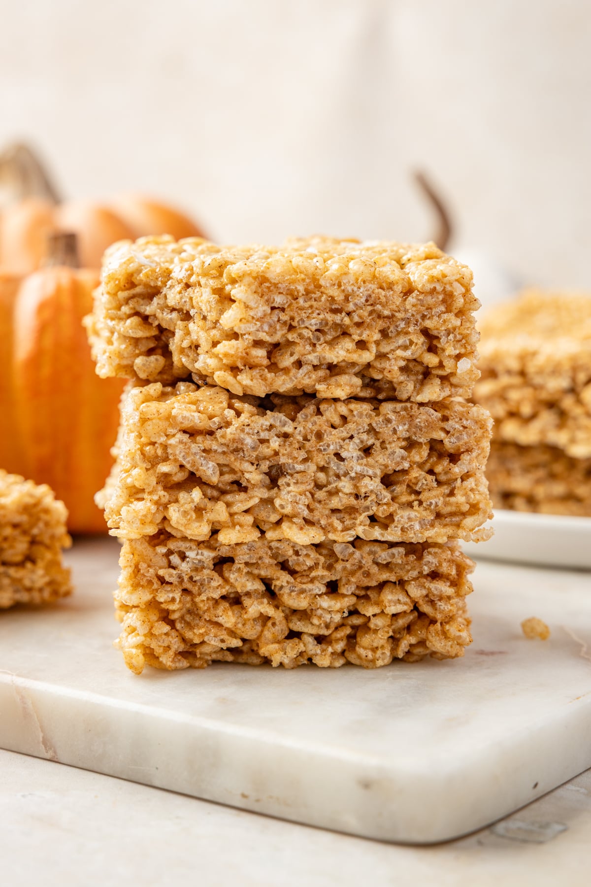 A stack of rice krispies treats made with pumpkin spice.