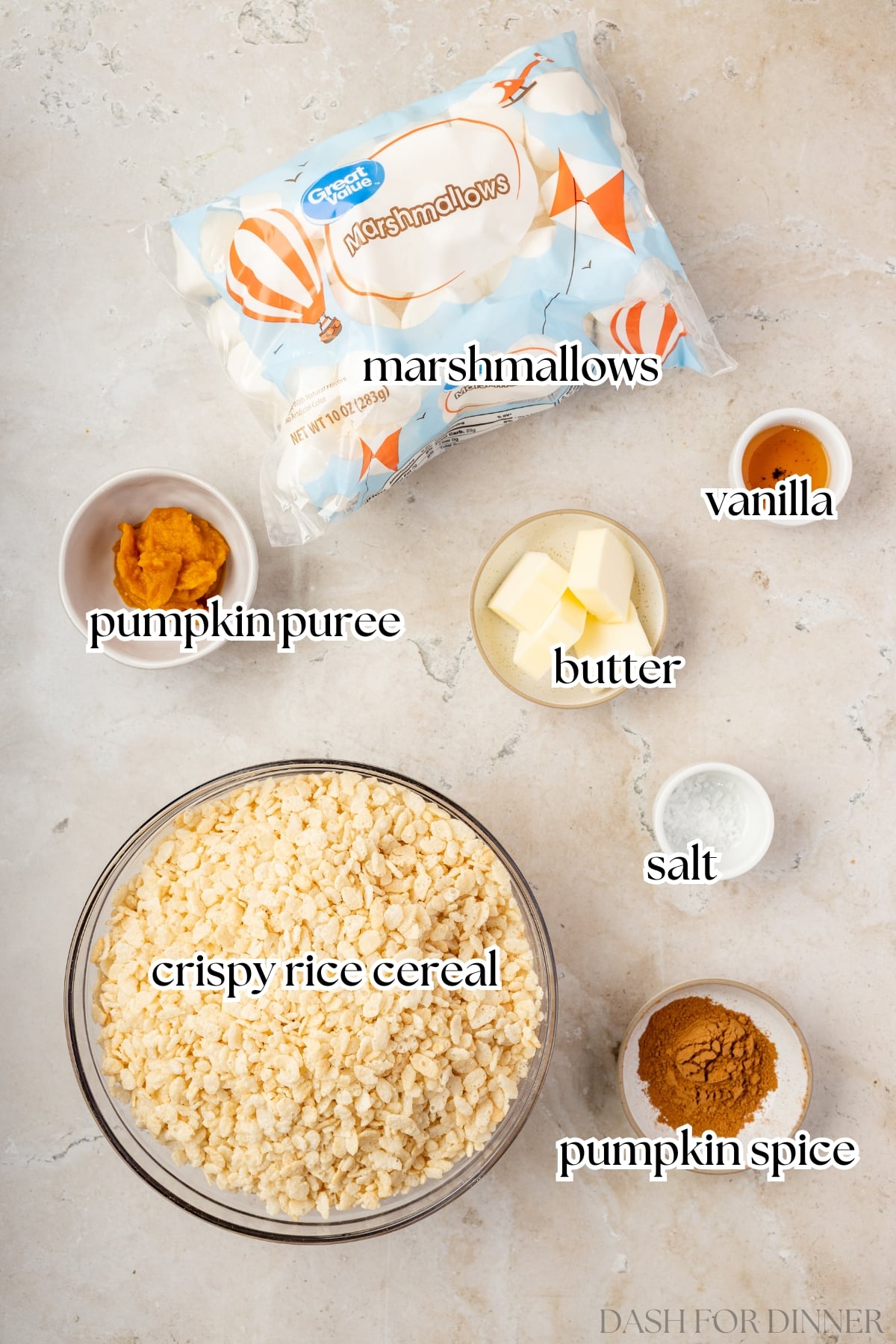 The ingredients needed to make rice krispies treats with pumpkin, including cereal, marshmallows, butter, and pumpkin pie spice.